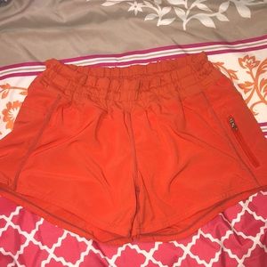 Orange Lululemon shorts
